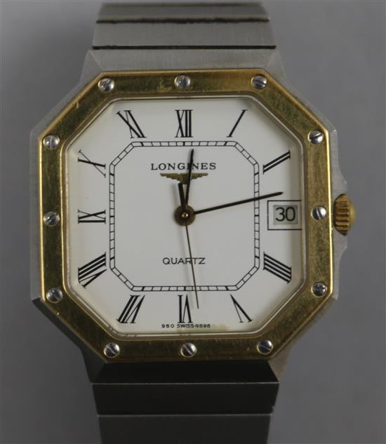 A gentlemans gold plated and steel Longines Quartz octagonal cased wrist watch.